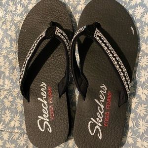 Skechers flip flops.